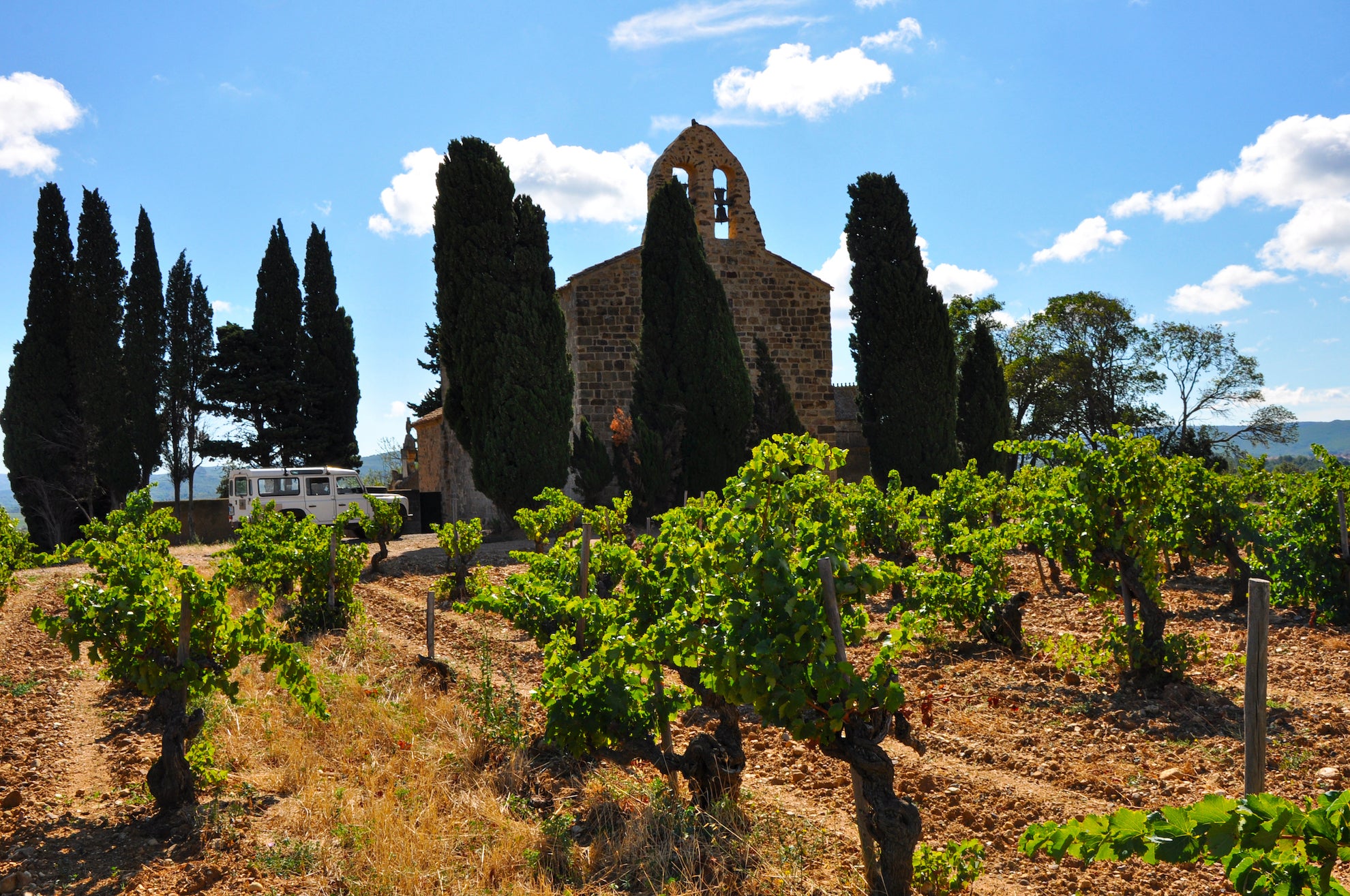 In the heart of Corbiéres, France (a classic and ancient Mediterranean growing region) 100 year-old vines surround a centuries-old church that is still in use today.